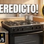 Fogão Atlas Mônaco Plus 5 bocas preto com mesa inox em cozinha moderna